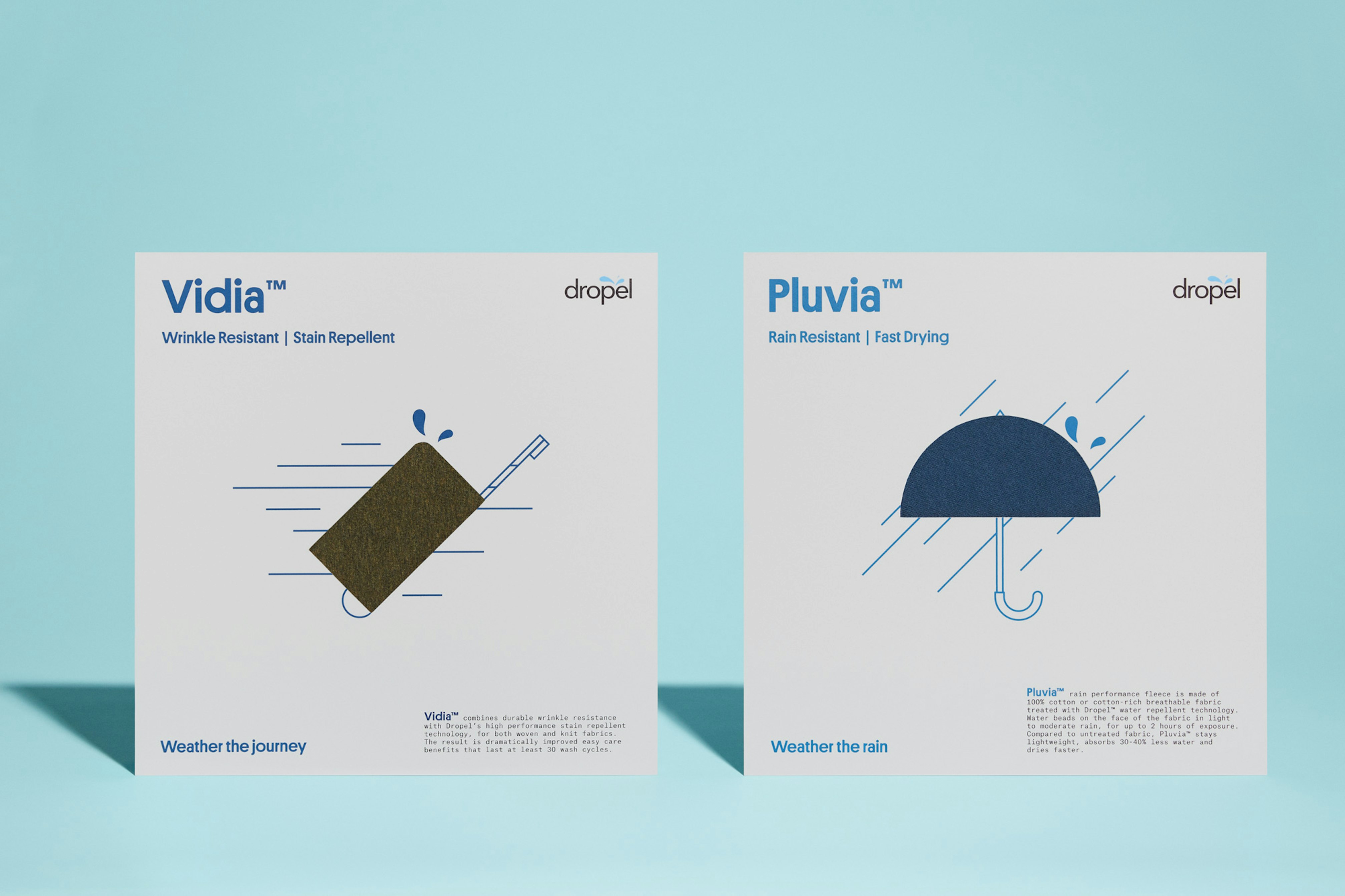 Photo showing two of Dropel's swatch cards standing on light blue seamless.