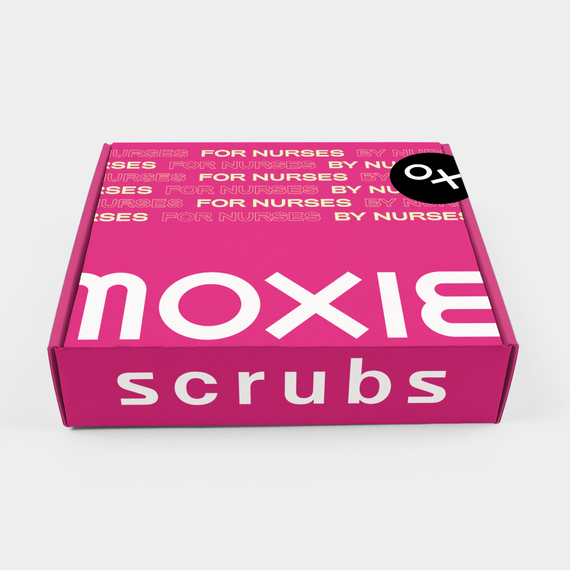 Moxie Scrubs' box packing in pink with the oversized wordmark in white and repeated phrase "For Nurses, By Nurses" and a black sticker with the symbol in white.