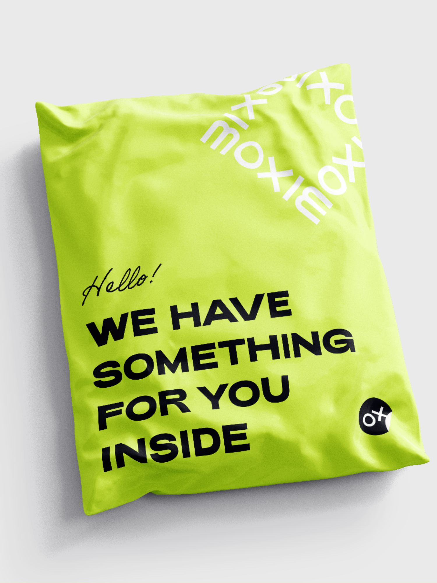 Moxie poly bag in chartreuse saying "Hello! We have something for you inside"