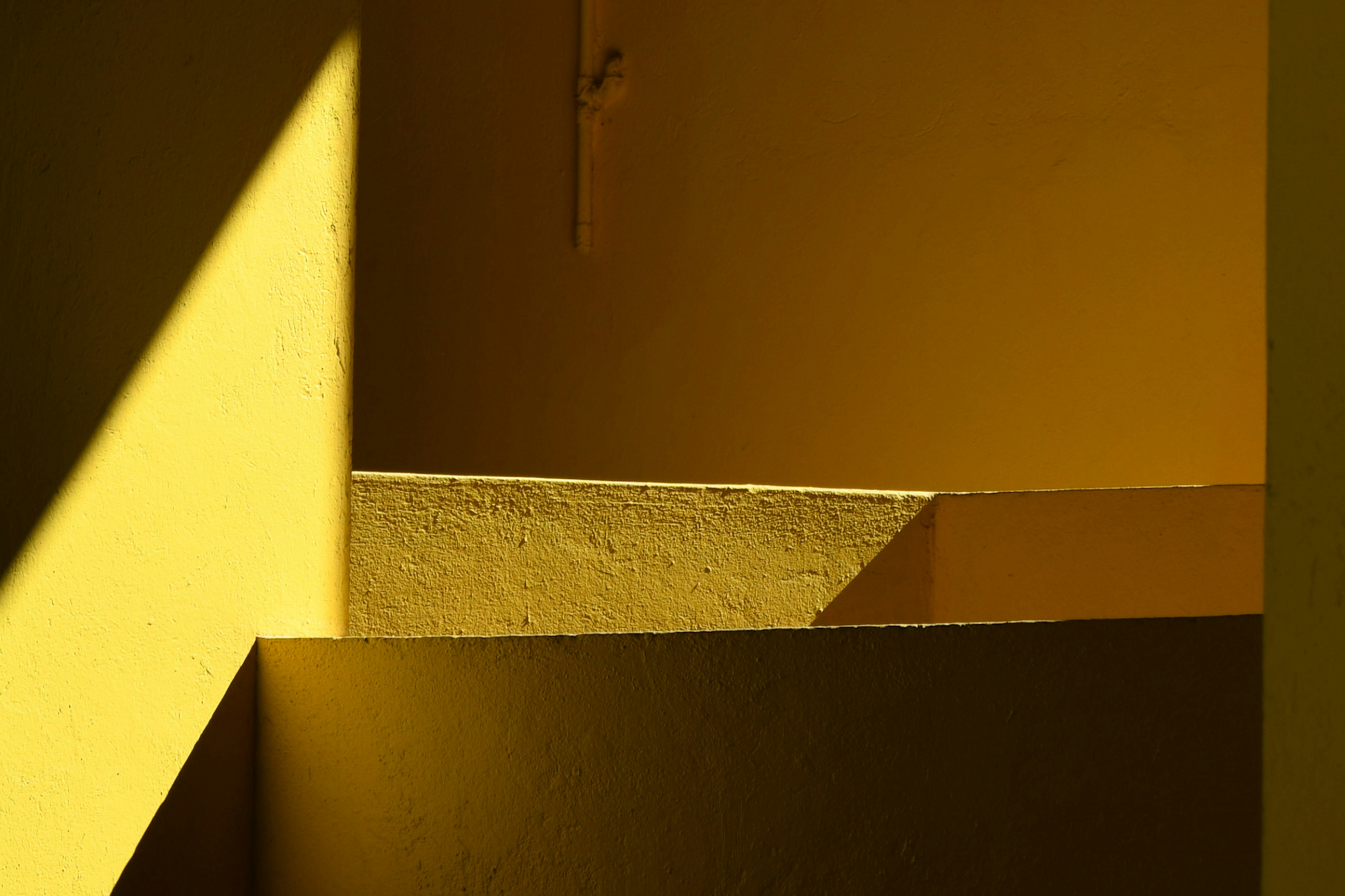 Photo showing yellow staircase detail.