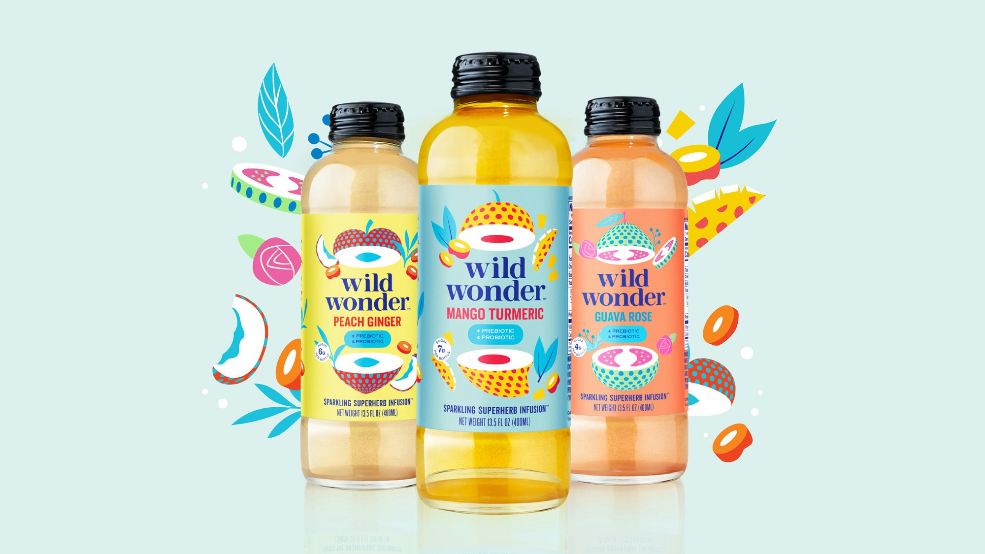 Three wild wonder bottles next to each other on a pale blue seamless. Behind them are colorful illustrations of fruit and plants.