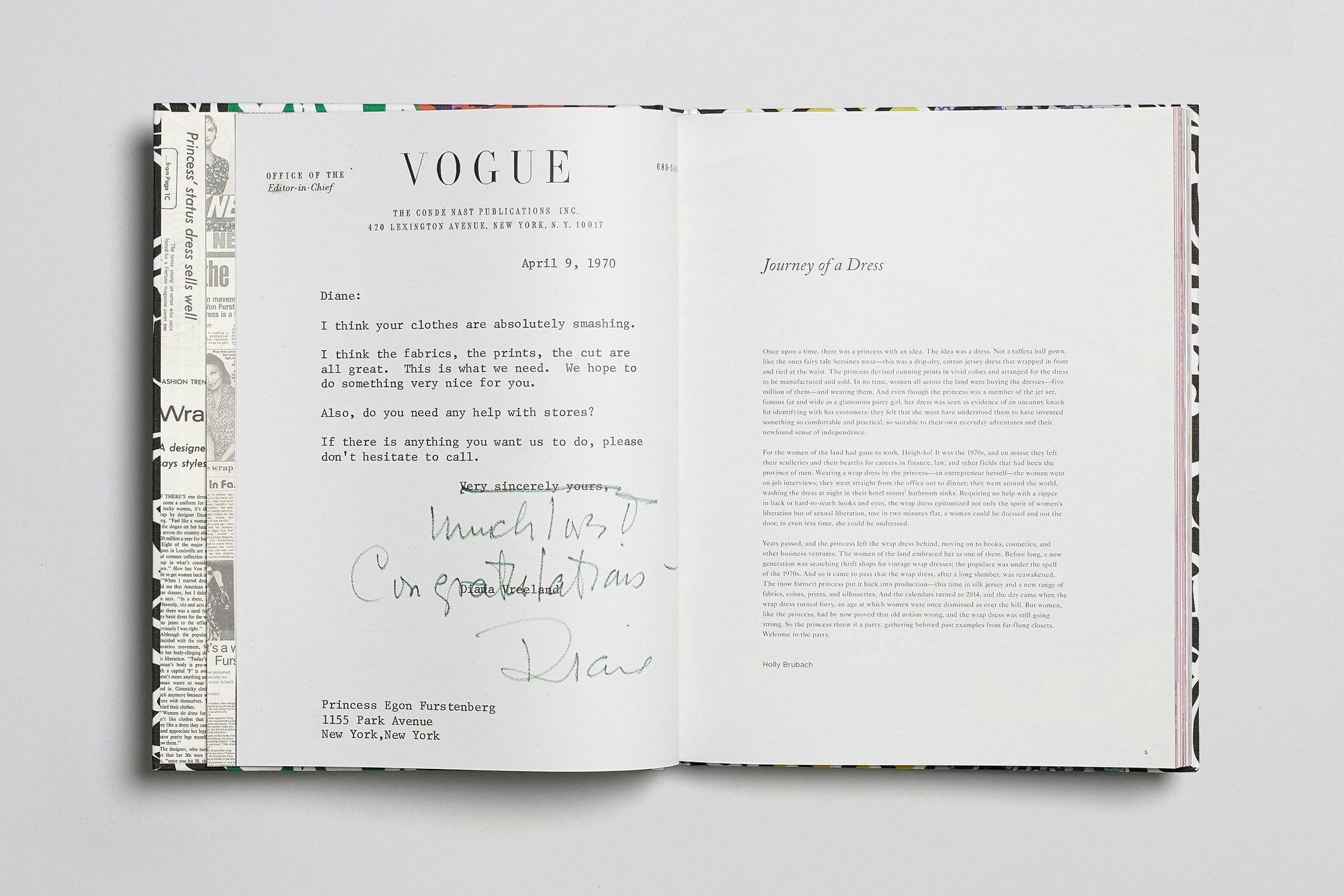Image showing the book open on a gray seamless. On the pages is shown the letter Furstenberg received from Vogue.