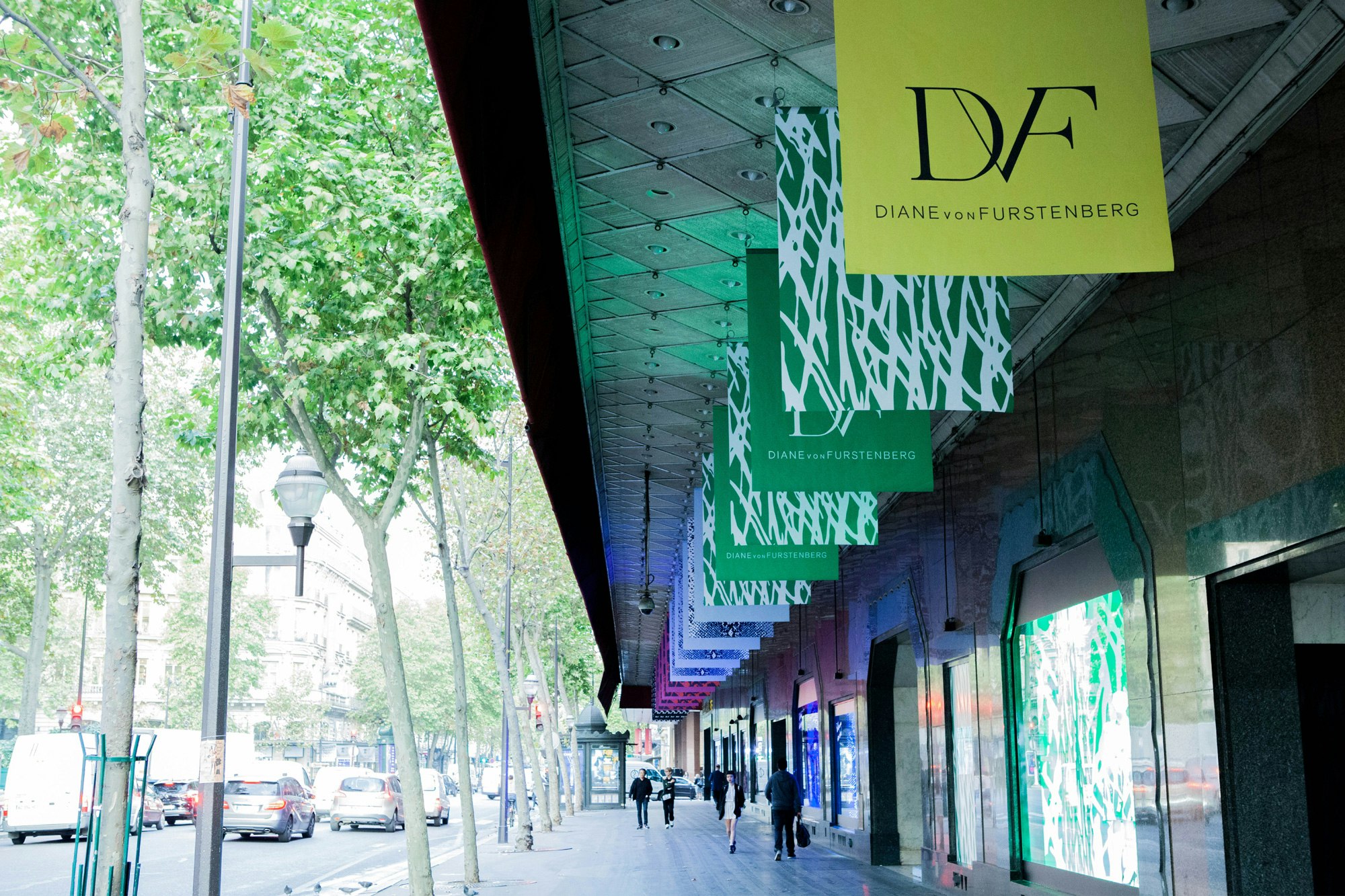 Image showing the outside of Galleries Lafayette in Paris, France. There are large boards hanging with all of DVFs prints.