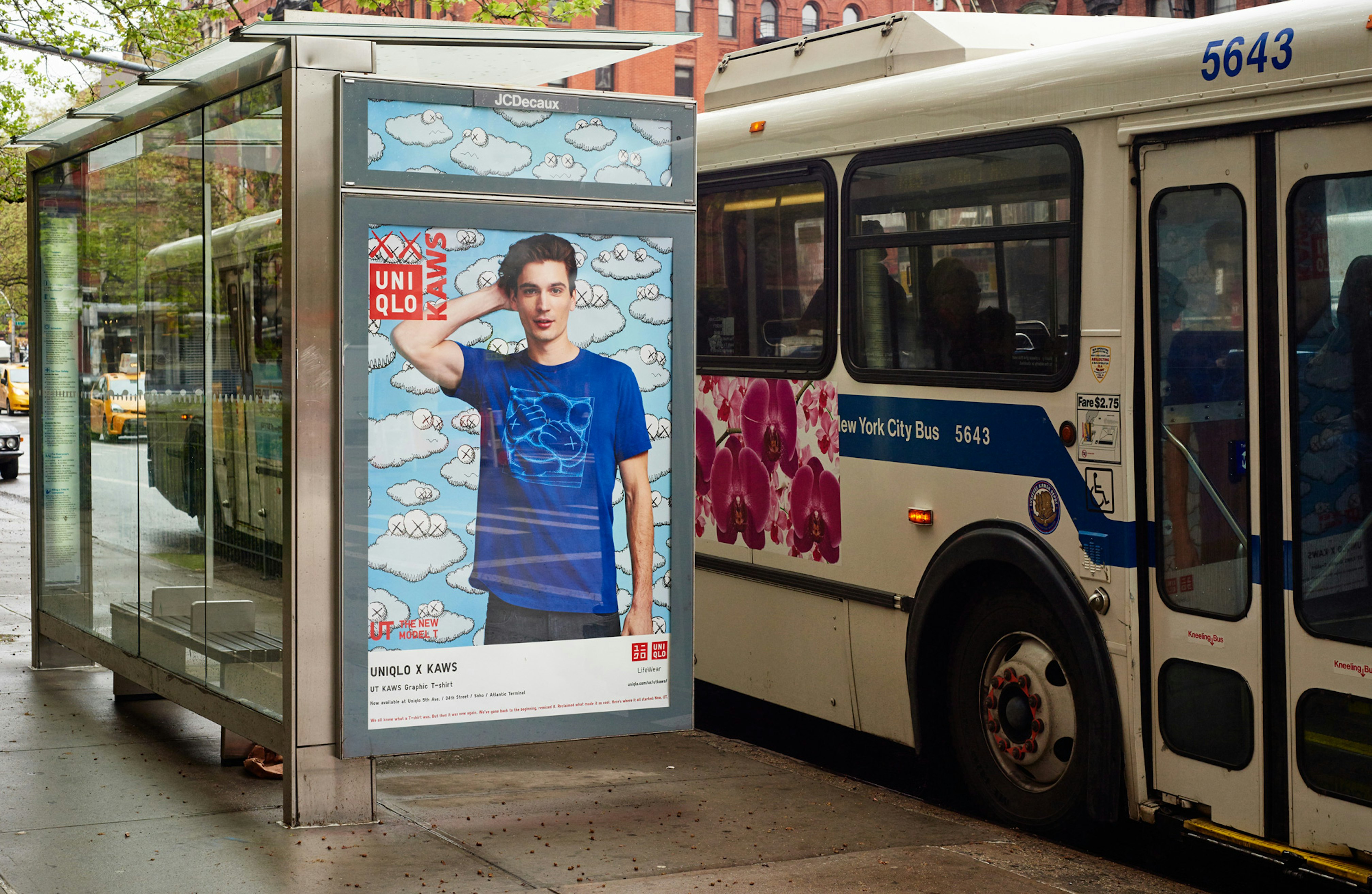 Image showing Uniqlo OOH poster on a NYC bus stop.