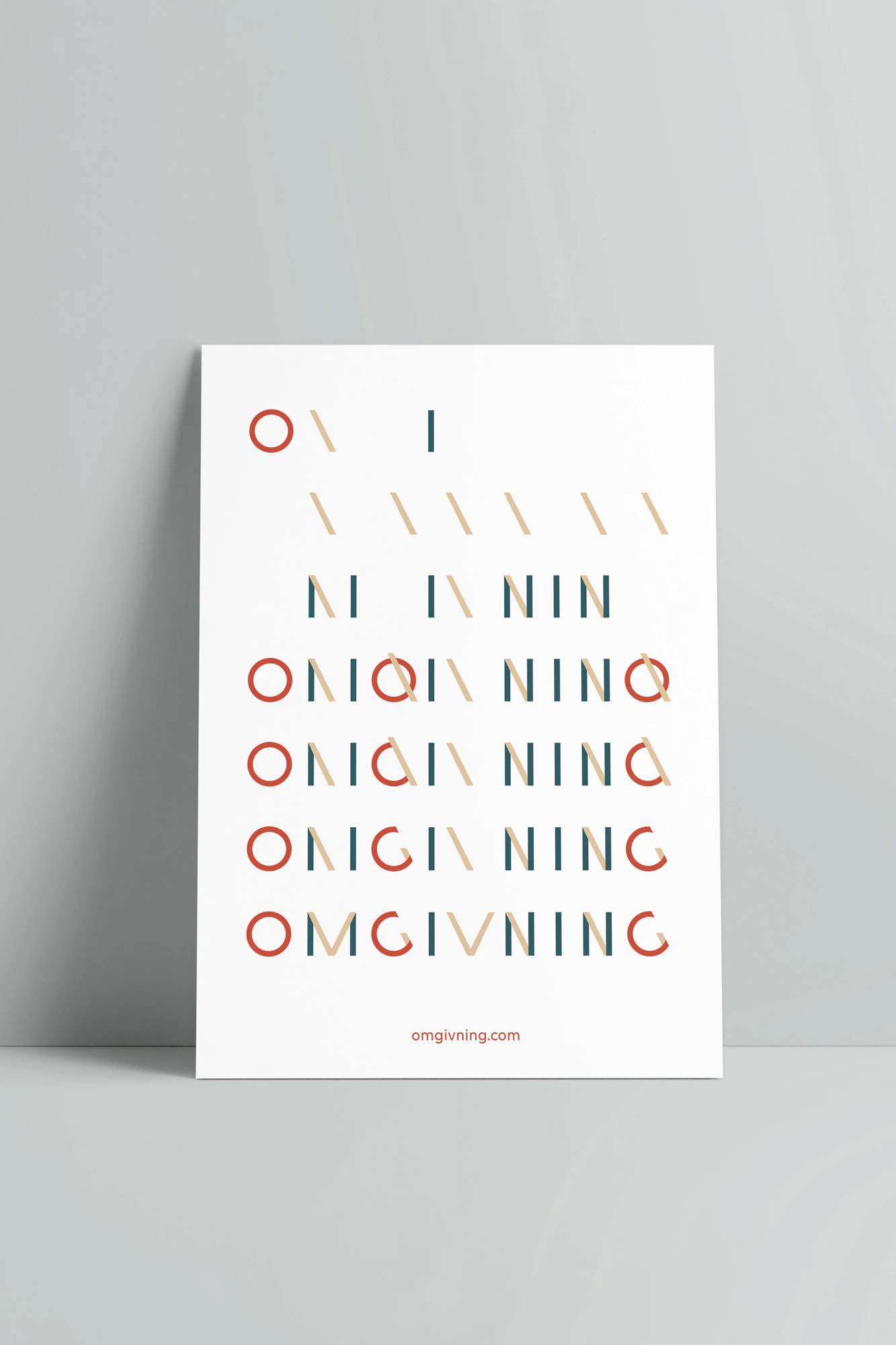 Image showing the Omgivning logo in colors on a white poster leaning against a gray seamless.