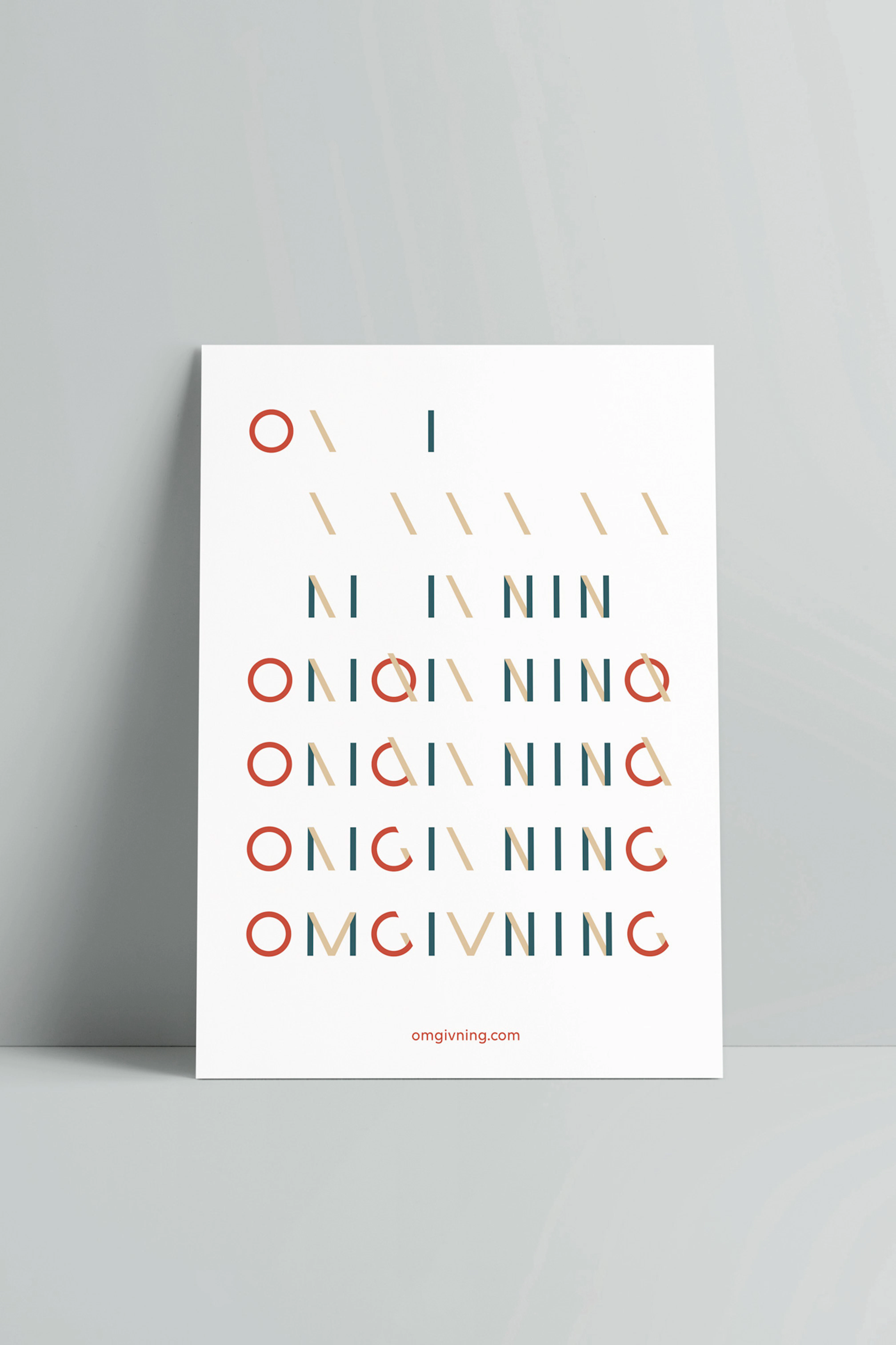Image showing the Omgivning logo in colors on a white poster leaning against a gray seamless.