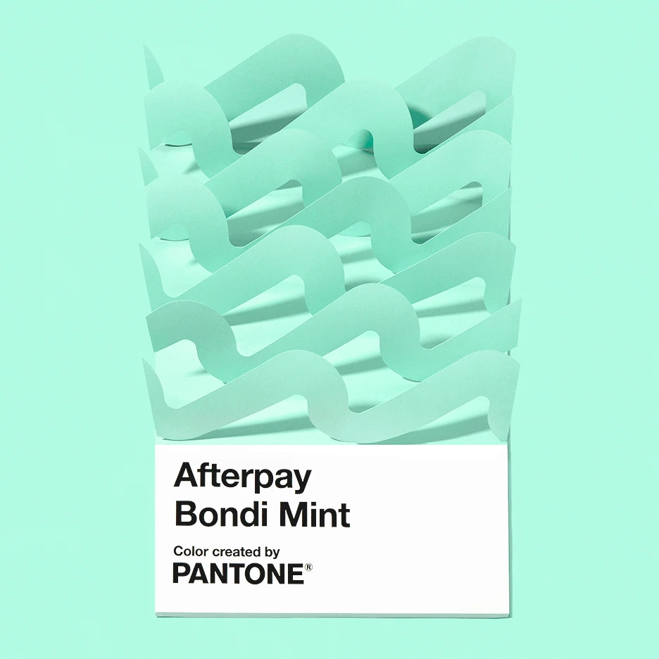 Animation showing an oversized Pantone chip saying Afterpay Bondi Mint with paper-waves coming and going.