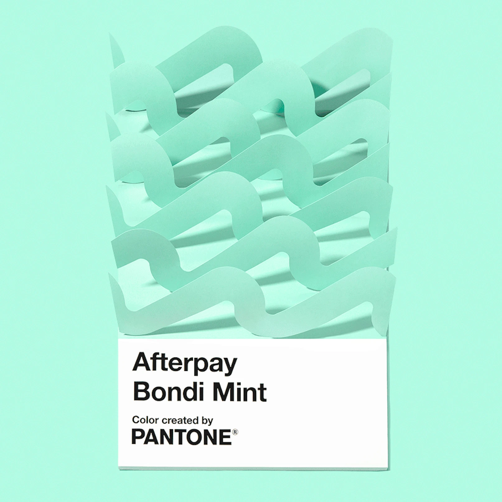 Animation showing an oversized Pantone chip saying Afterpay Bondi Mint with paper-waves coming and going.