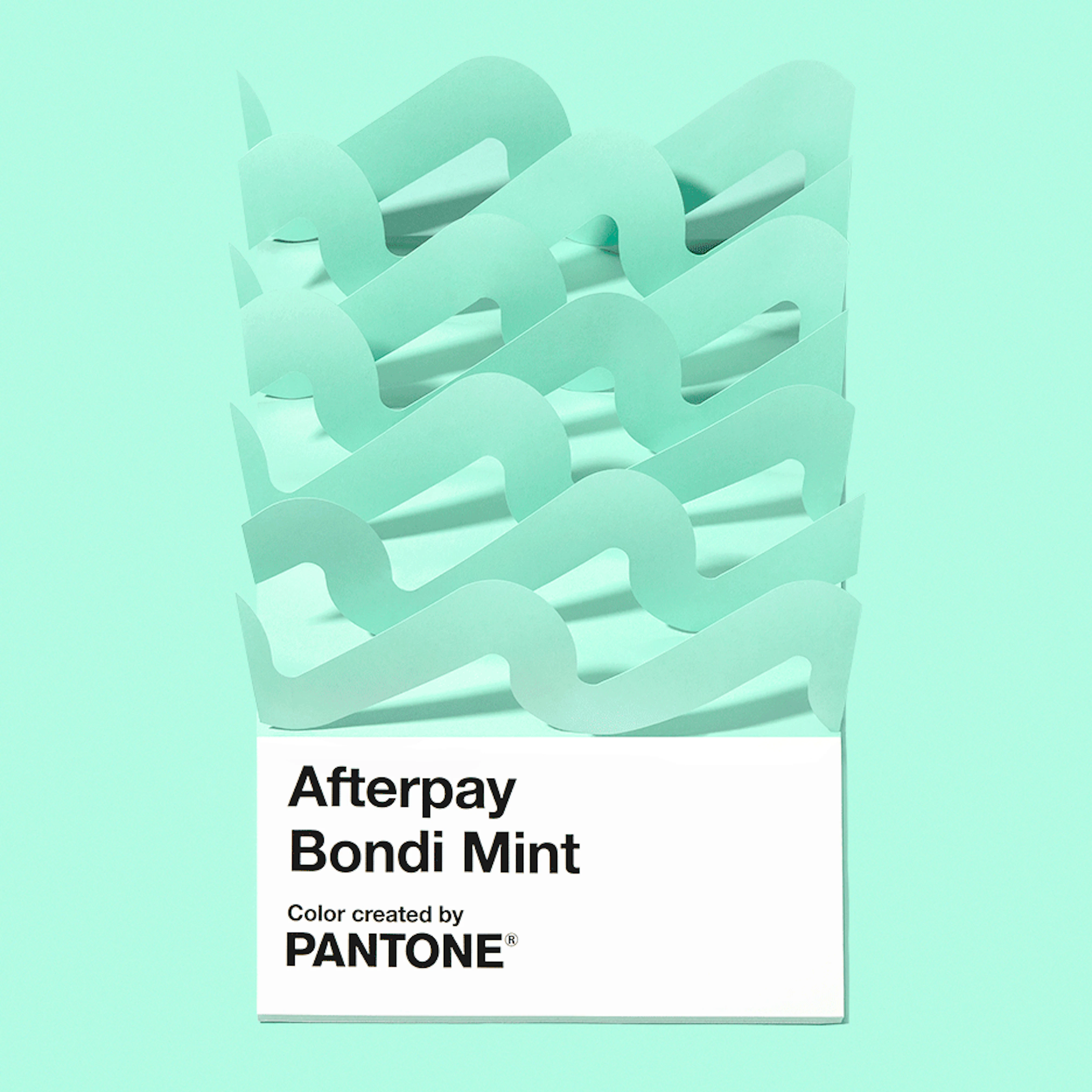 Animation showing an oversized Pantone chip saying Afterpay Bondi Mint with paper-waves coming and going.