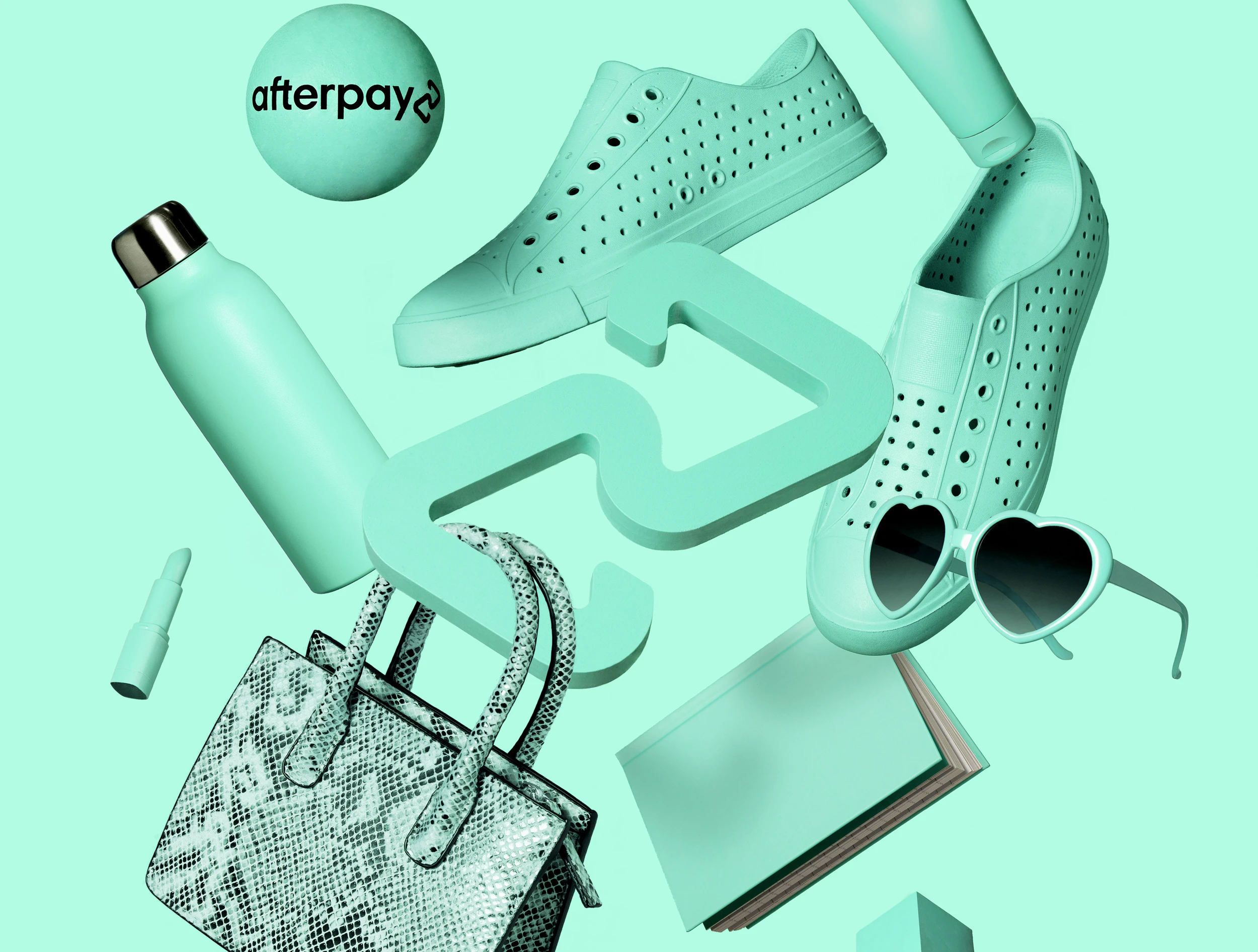 Image showing various products in the Bondi mint color floating in the air. There is a pair of shoes, a water bottle, a handbag, a notebook, a pair of sunglasses, lipstick, lotion. In the middle is a 3D model of the Afterpay logo.