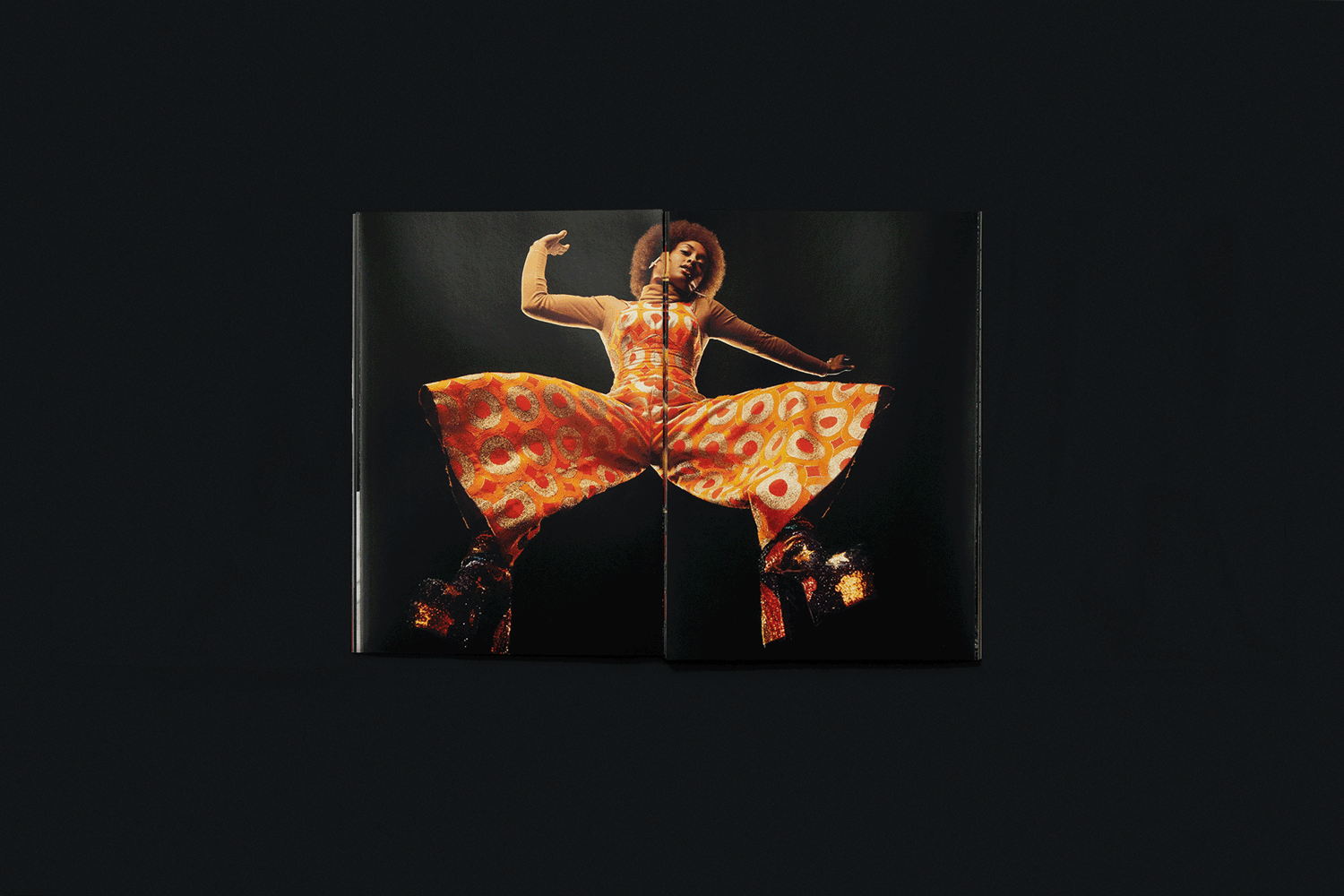 Animation shows a book's pages opening to reveal photographs of people dancing on a black background.