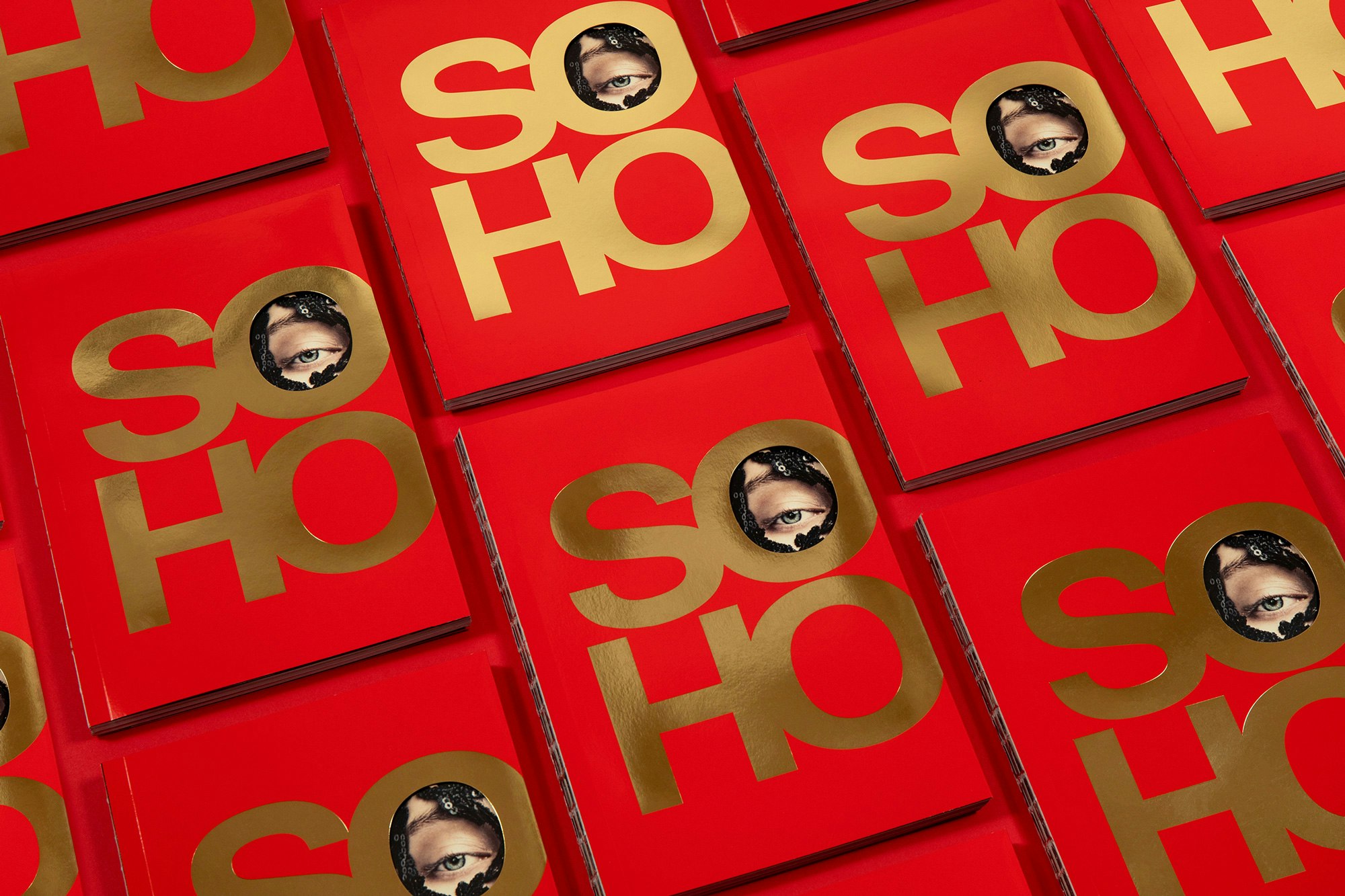Image shows a grid of red books with the letters SO HO on it, with an eye peeking through the first O.