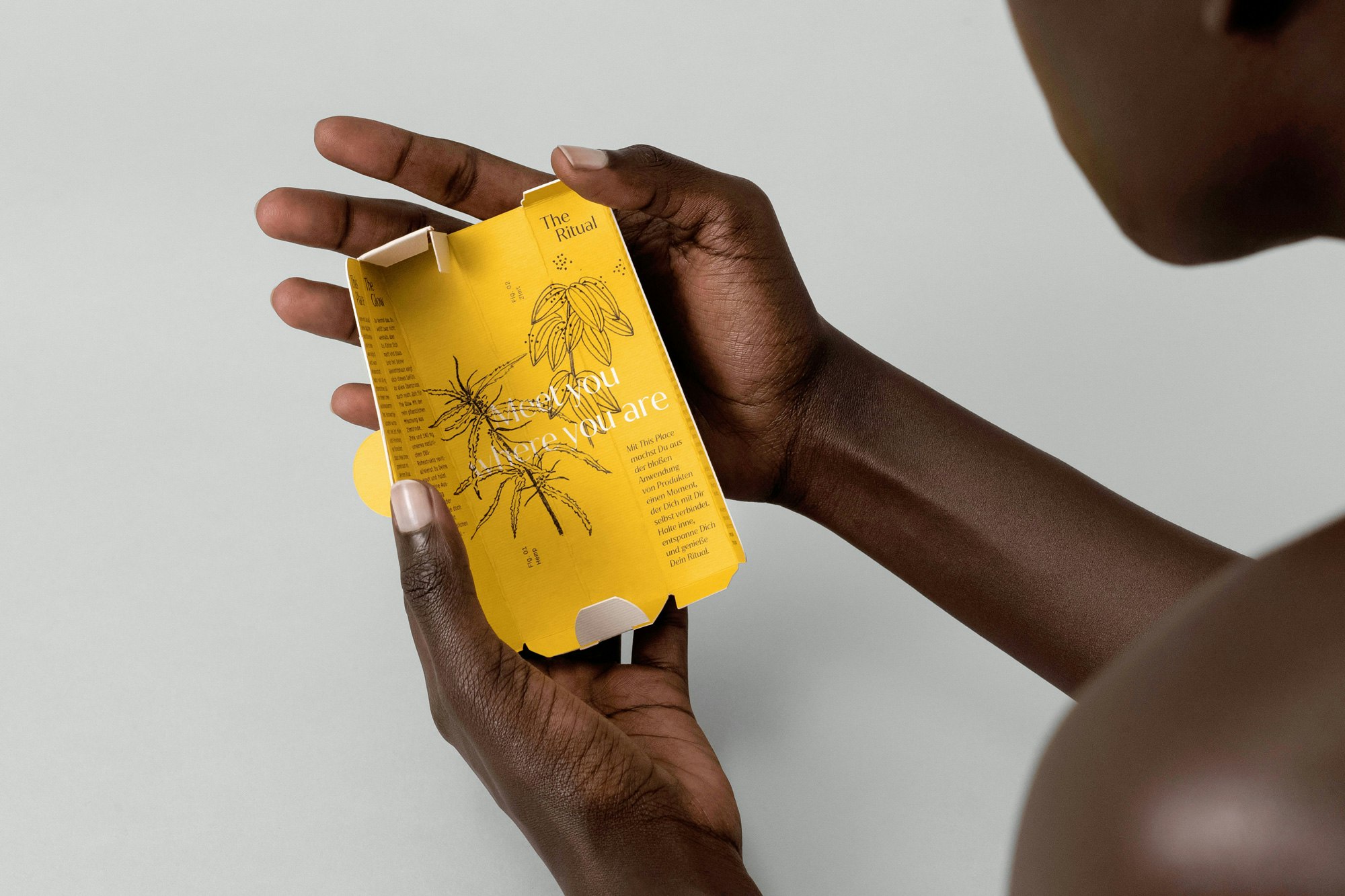 Photo showing person holding the packaging open, reading the inside writing on the ingredients.