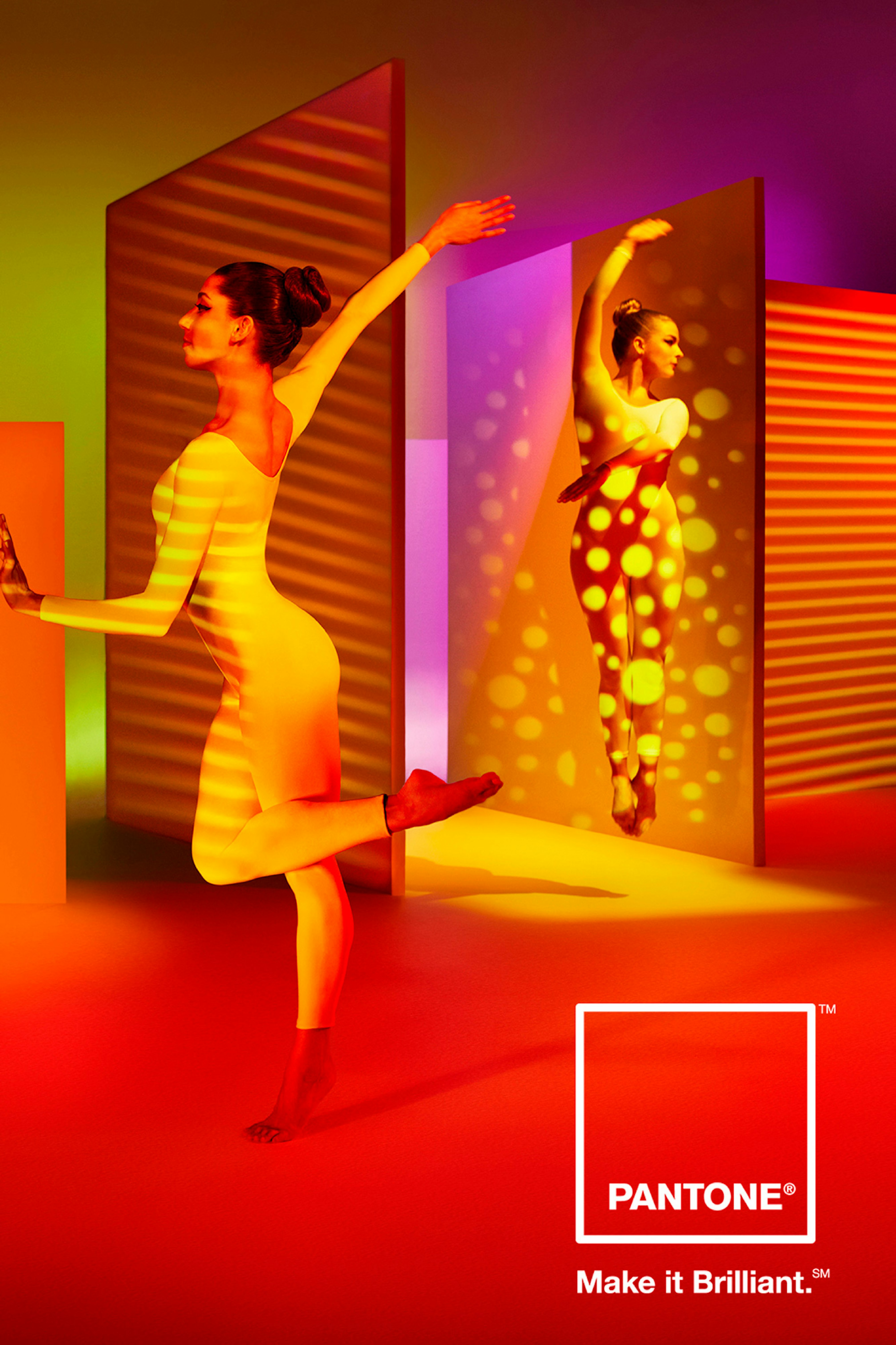Image of two people in white leotard dancing against red, violet, yellow shapes and colors.