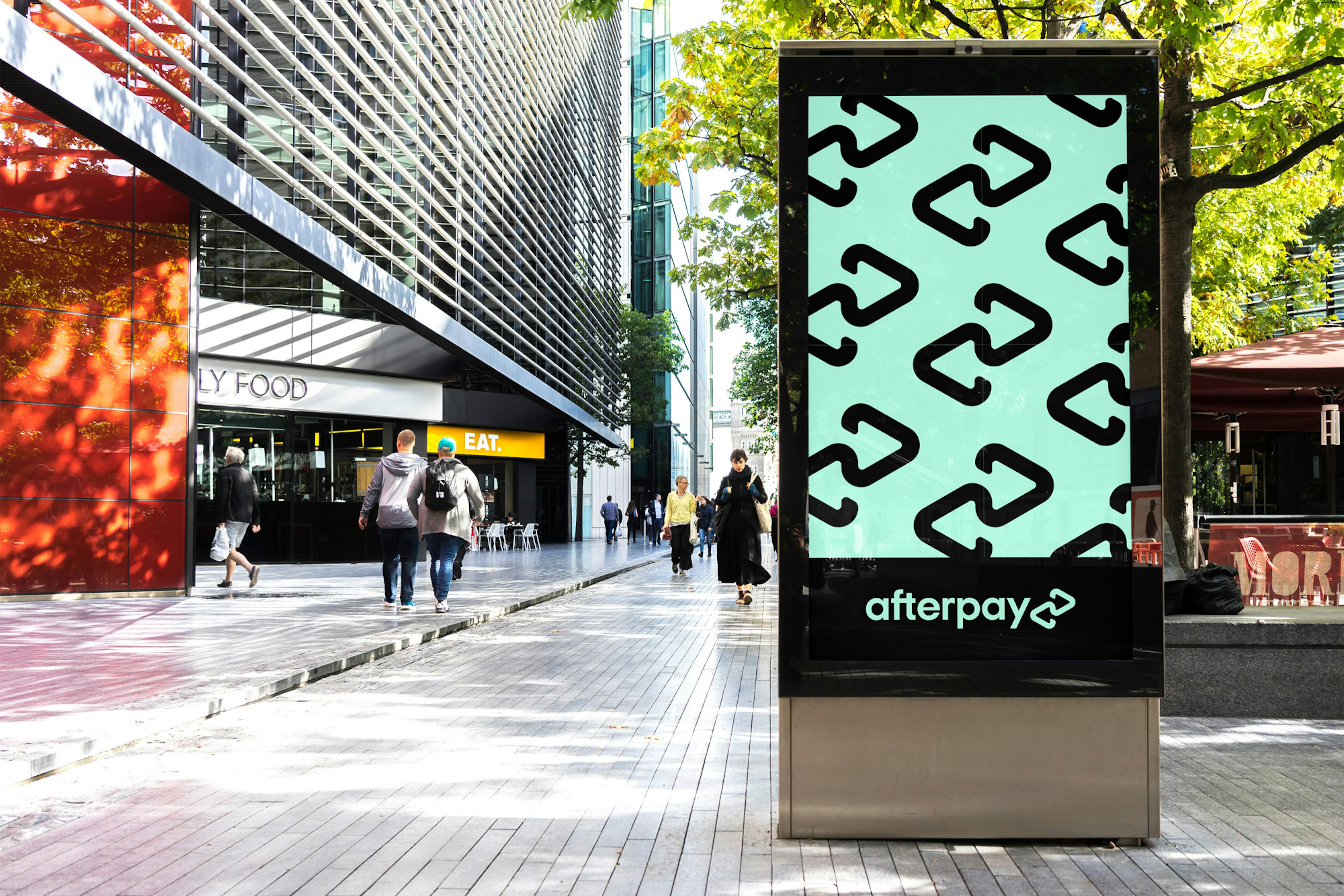 Image showing a mock up of a digital advertising screen in the street showing the Afterpay logo repeated in black on the Bondi mint ground.