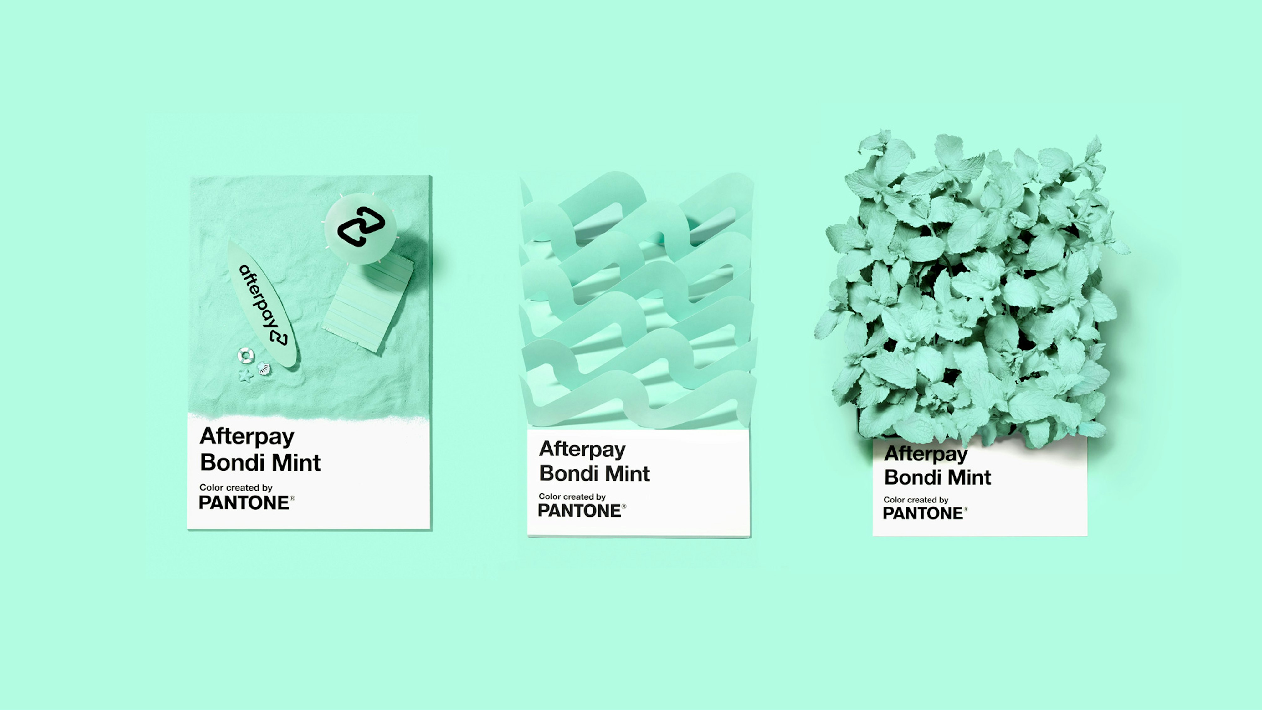 Image showing three oversized Bondi Mint Pantone chips, each with a dimensional all mint prop in the space where the flat color usually is. The first one has mint sand, a mini mint surfboard saying Afterpay, a mini mint towel, and a mini mint umbrella. The second one has waves cut out of paper aligned next to each other, and the third one is filled with Bondi mint colored mint plants.