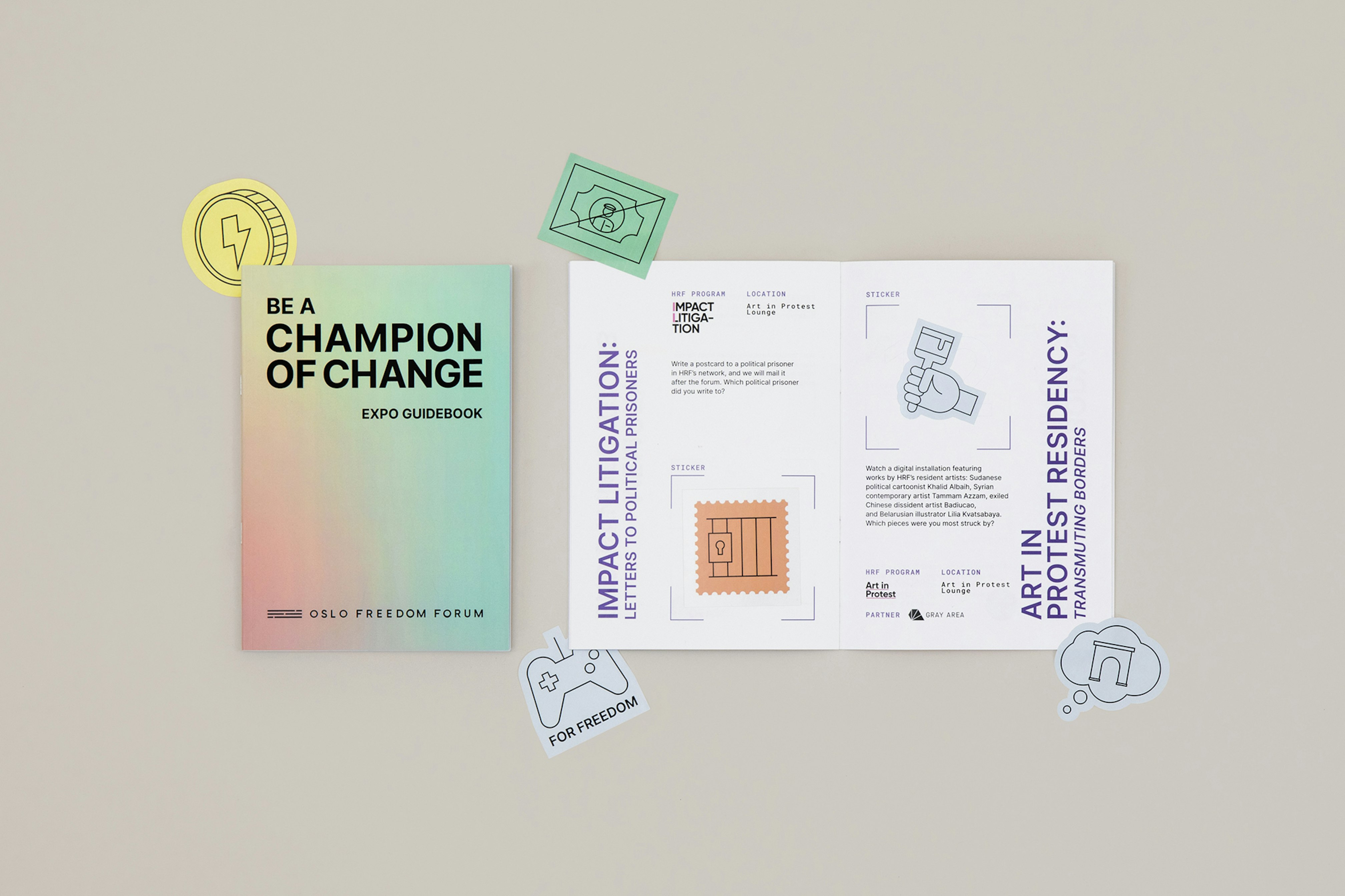 Be a champion of change expo guidebook with stickers around it.