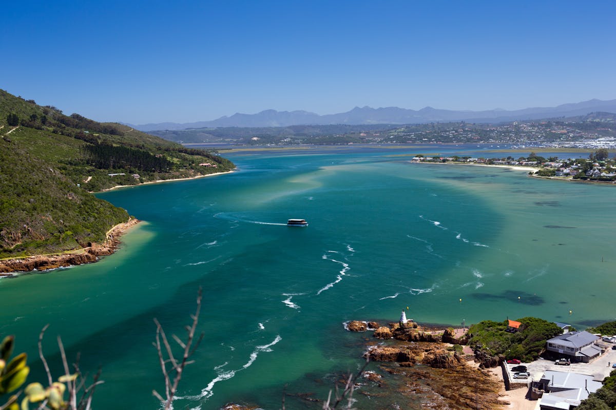 Sky view of Knysna lagoon and its blue, turquoise and green reflections - Image by Ron Porter of Pixabay