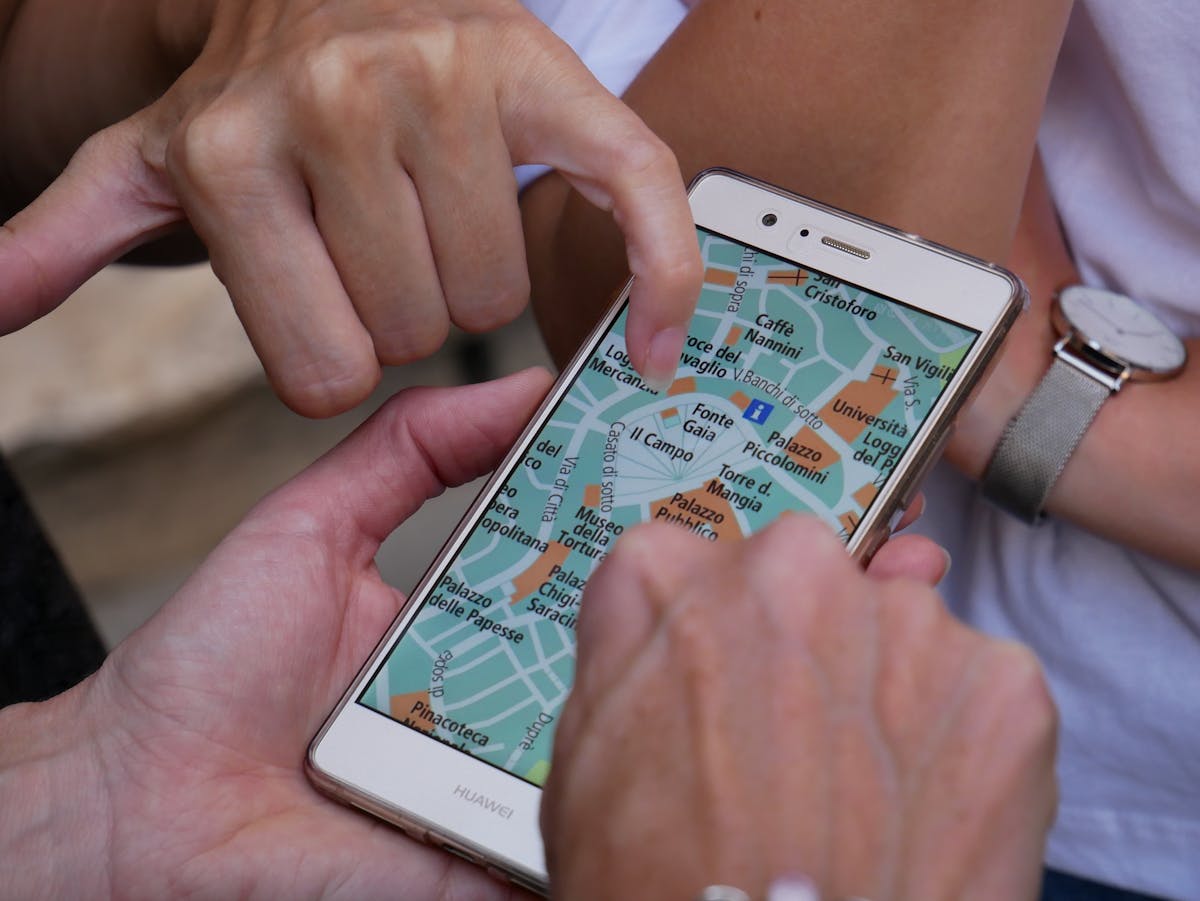 White smartphone with interactive road map - Photo by Sebastian Hietsch on Unsplash