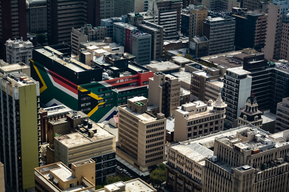 Johannesburg seen from the sky with buildings in the colours of the South African flag - Photo by Jacques Nel on Unsplash