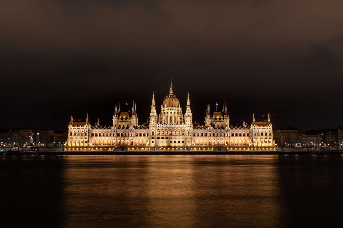 Photo of the Hungarian Parliament in Budapest, standing on the river bank