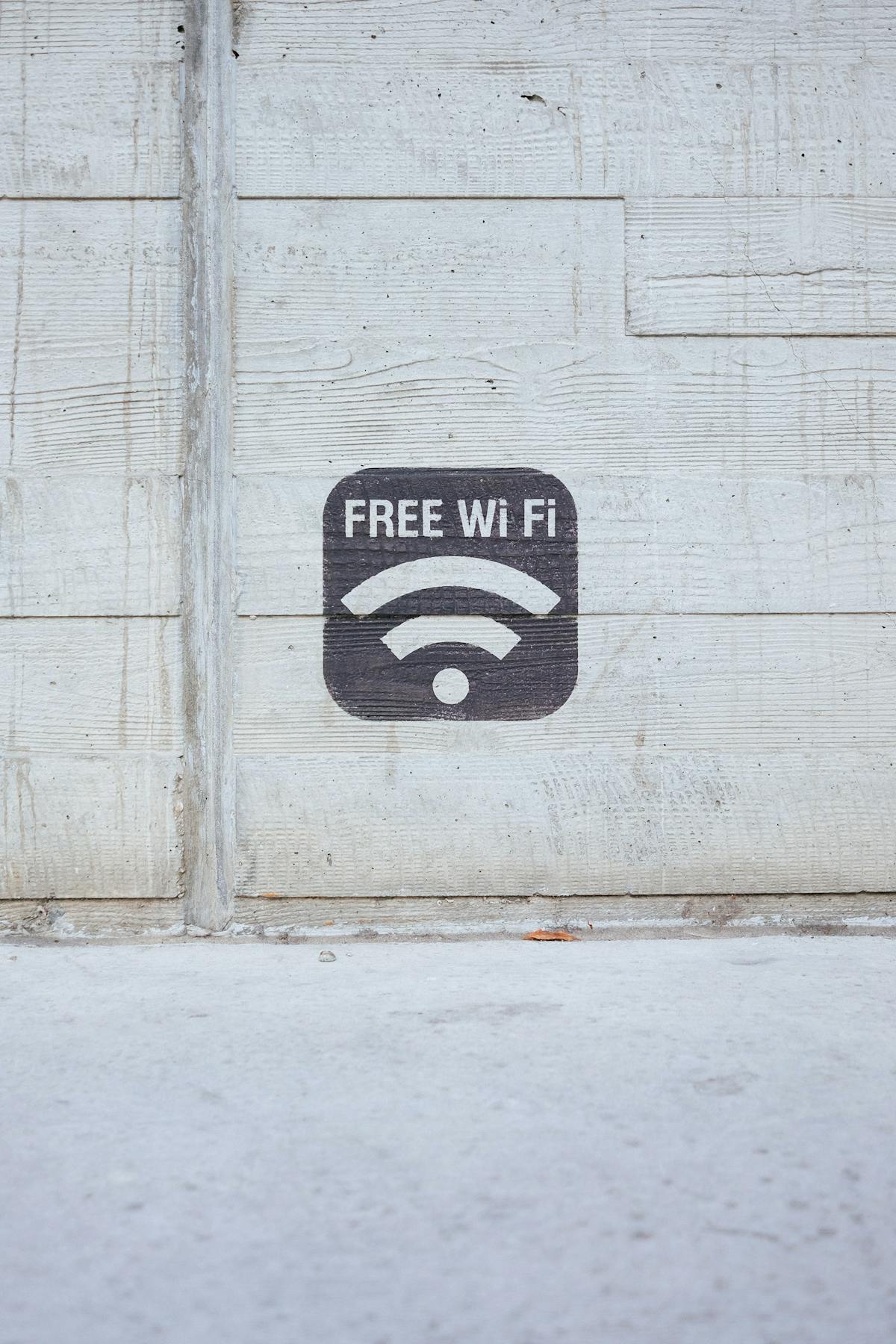 A white wooden wall with the wifi icon and the text
