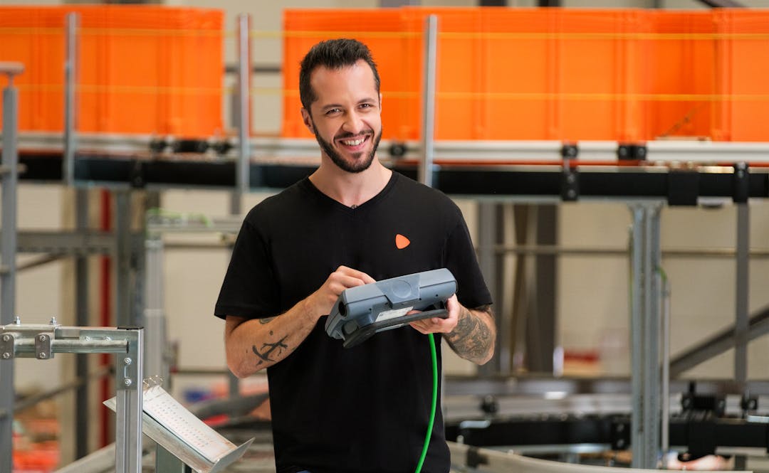 A person using a controlling device to control the electric ramp