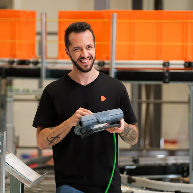 A person using a controlling device to control the electric ramp