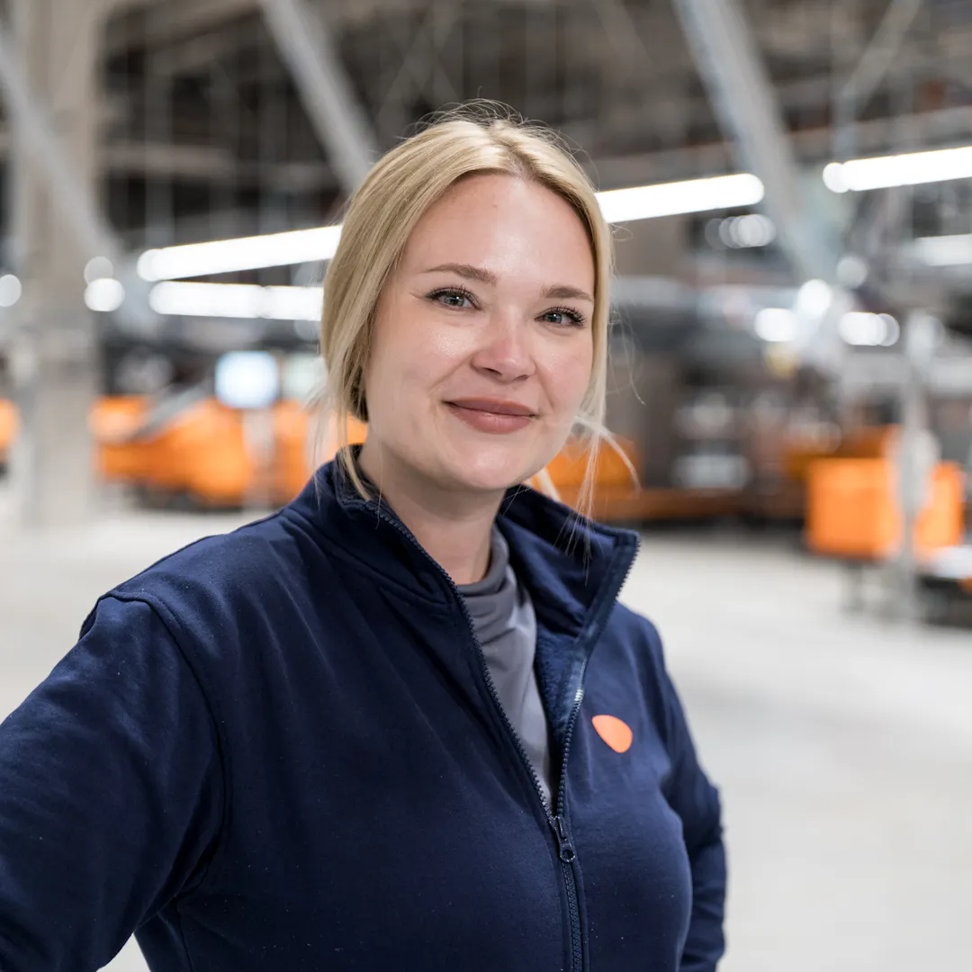 A women standing in a Logistics centre.
