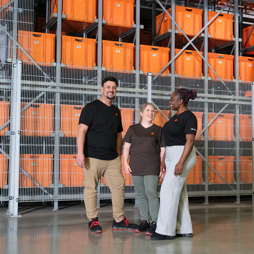 A group of Logistics employees at a warehouse.