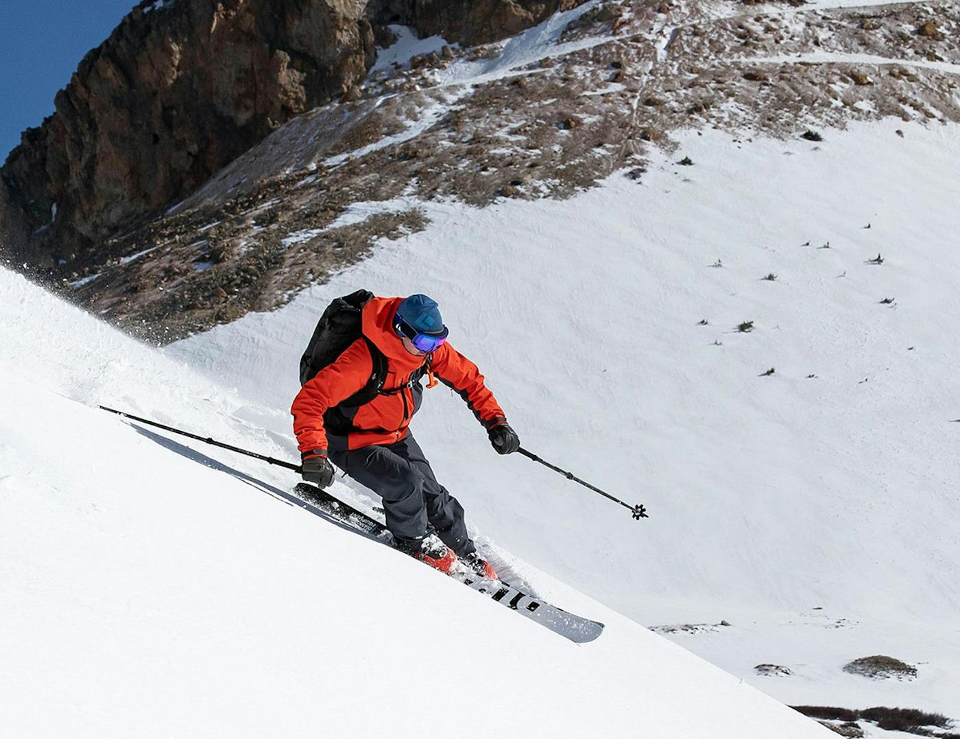 Man skiing down a mountain using Black Diamond gear