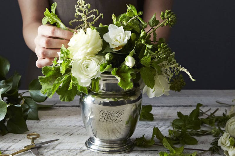 Creating a white floral arrangement in a pewter vase