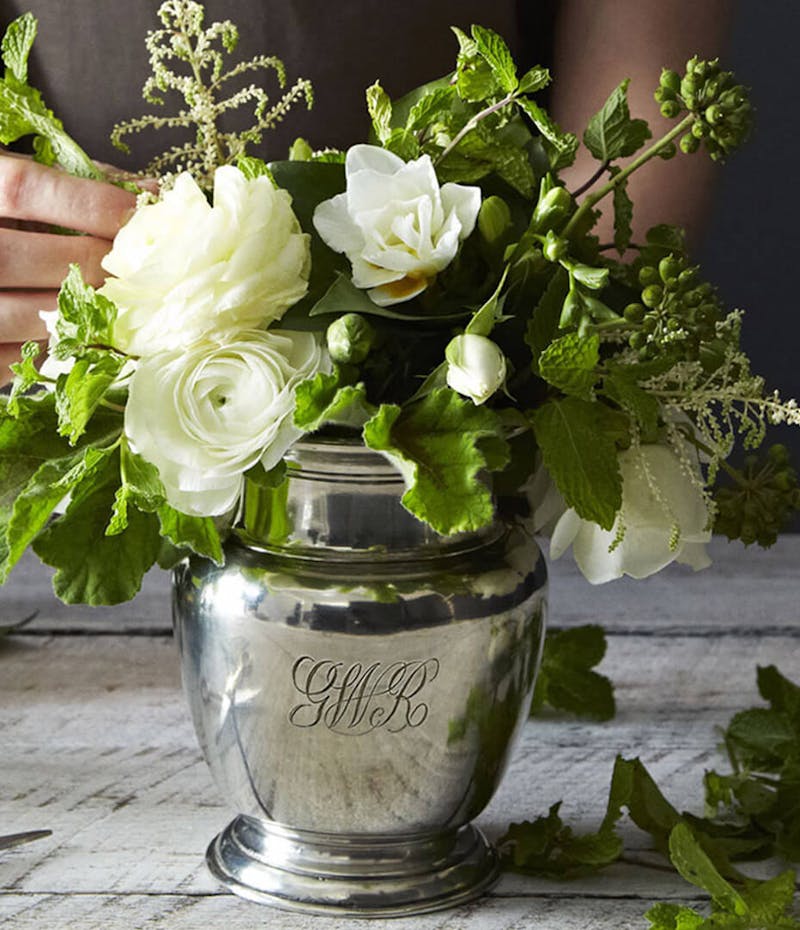 Creating a white floral arrangement in a pewter vase