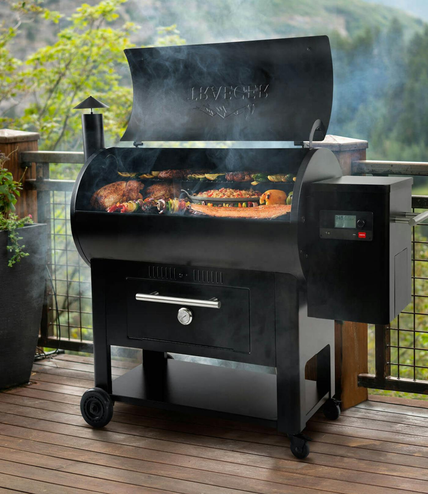 Traeger grill that is open with food cooking and smoke