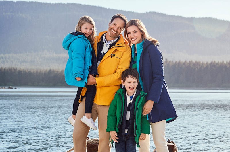 Family wearing land's end clothing standing in front of a lake