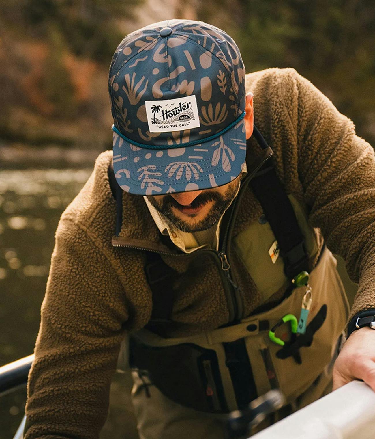 Man fishing while wearing Howler Brothers clothing