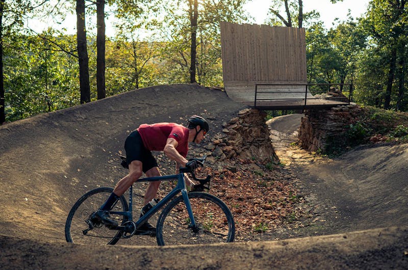 Main riding an Allied bicycle on a trail outdoors