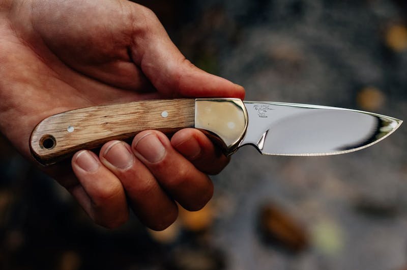 Man's hand holding hunting knife