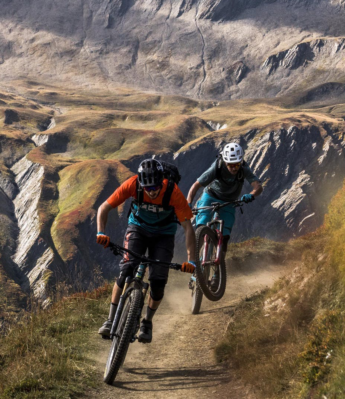 Two men riding bikes