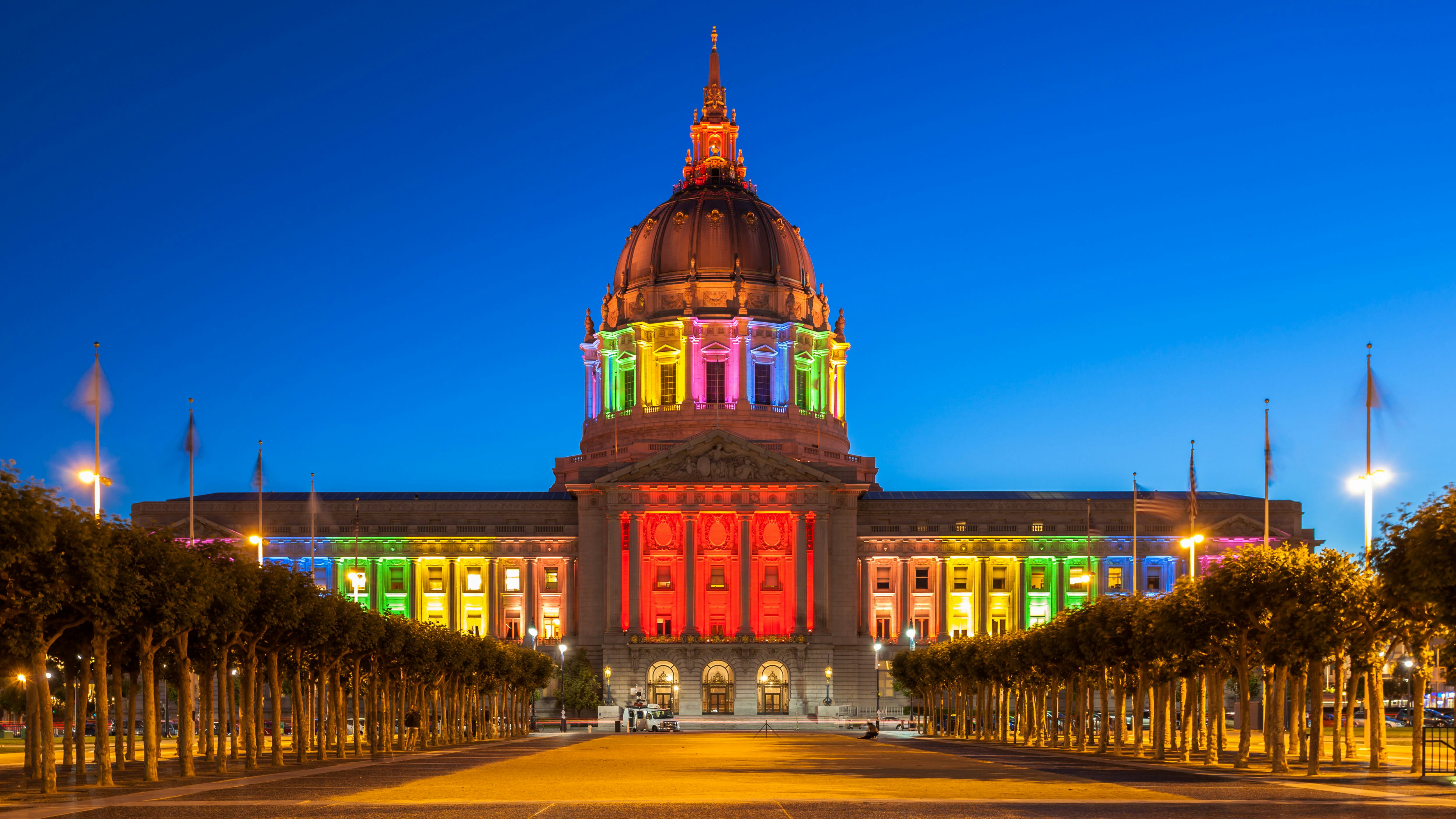 City Hall in San Francisco lit up with rainbow colors in honor of Gay Pride Month. 