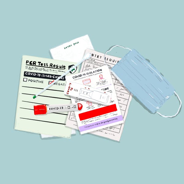 COVID-19 results, test, and isolation paperwork plus a blue medical mask