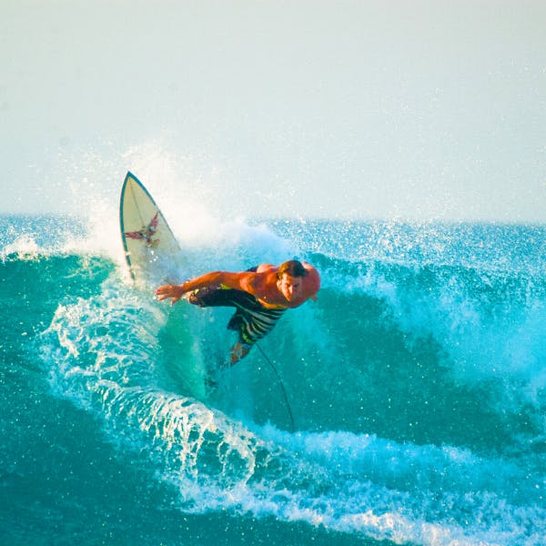 Male surfer riding a wave 