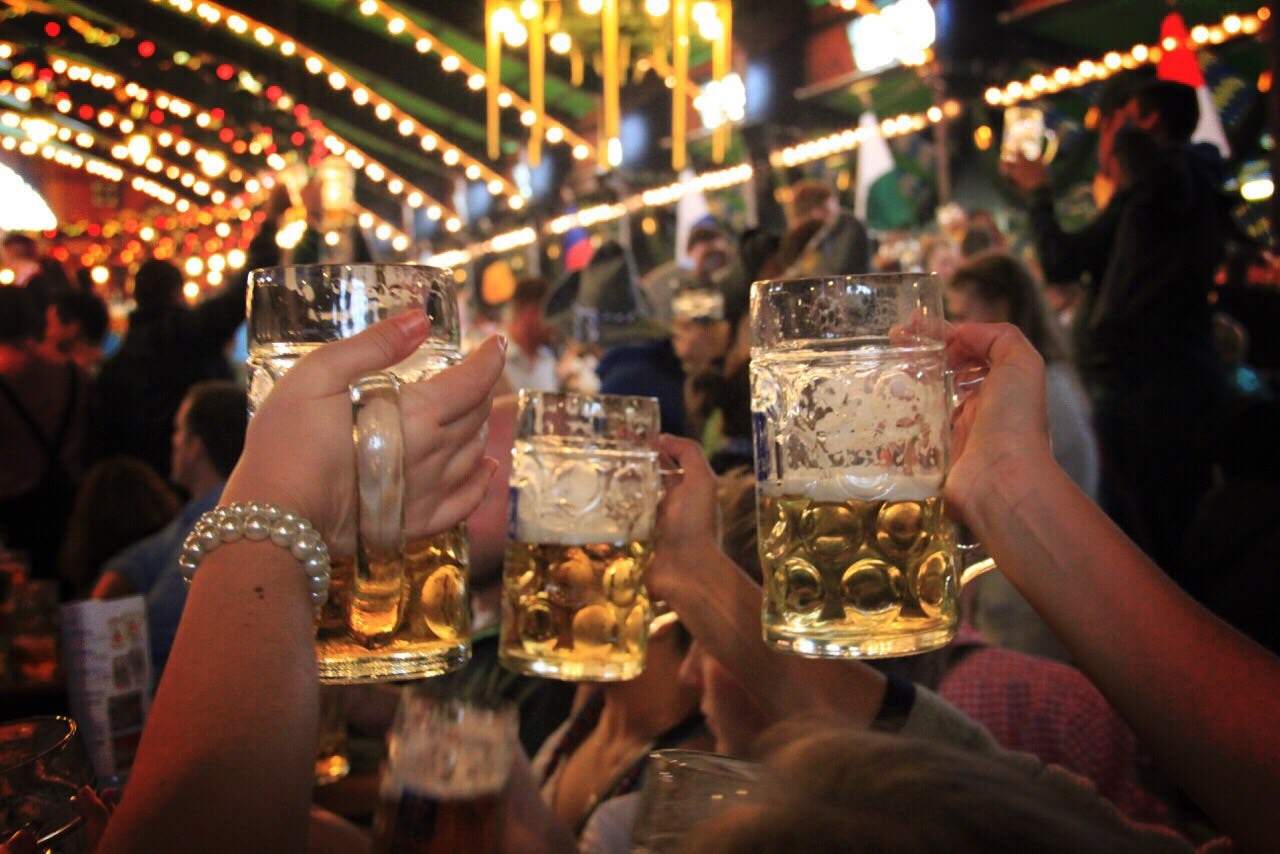 3 People cheering at a beer festival