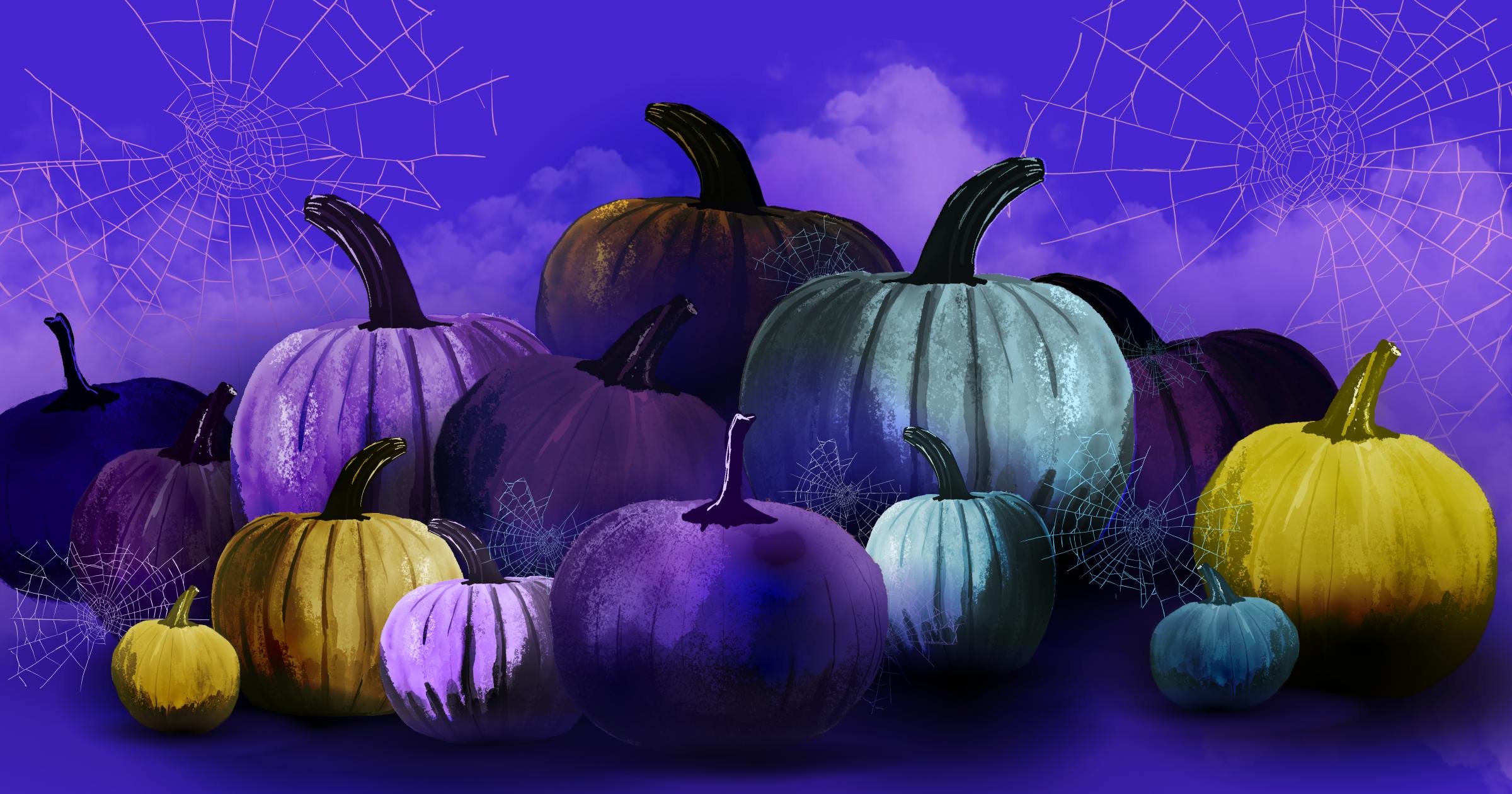 Different colored pumpkins and spiderwebs for Halloween