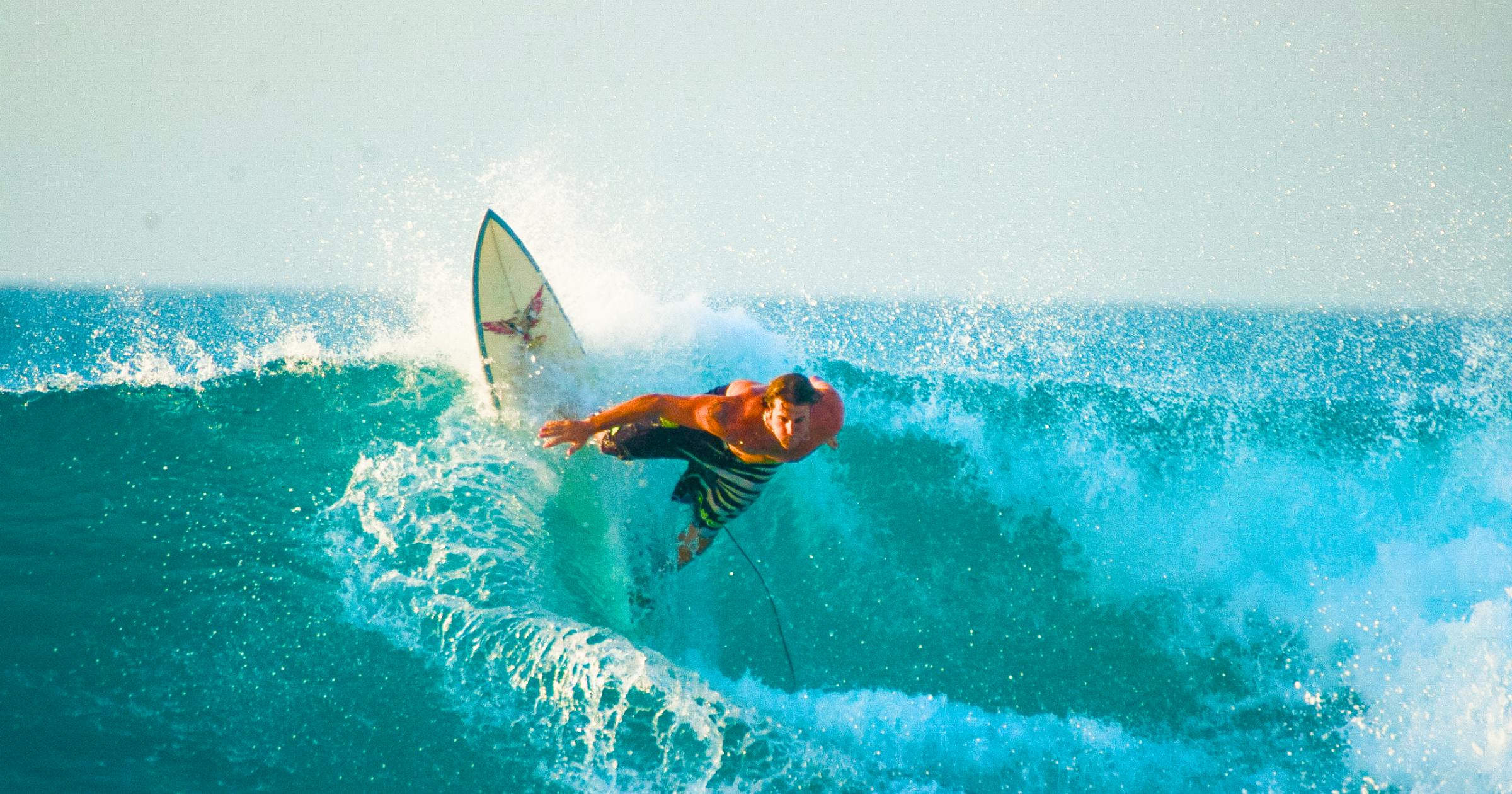 Male surfer riding a wave