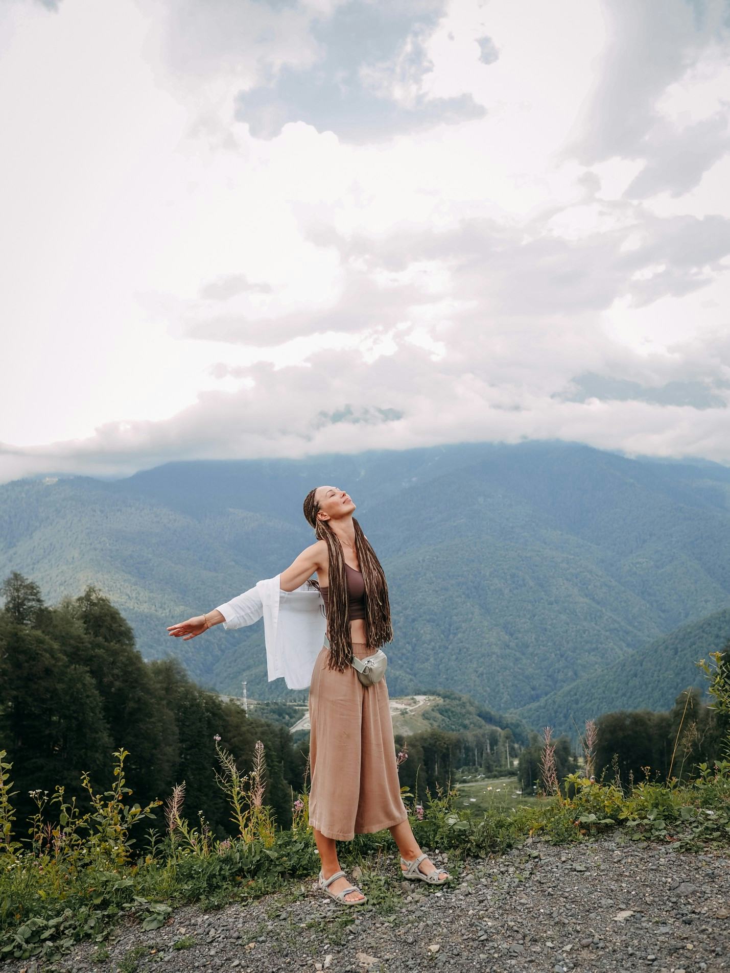 Woman with arms spread taking in the scenery