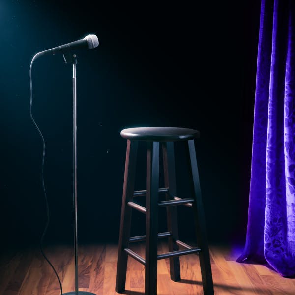 Mic, stool and curtain for a comedy set