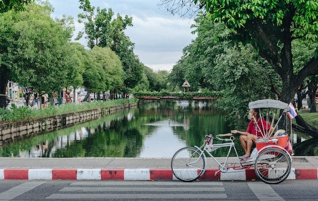 A man with his rickshaw waiting for customers in Chiang Mai, Thailand