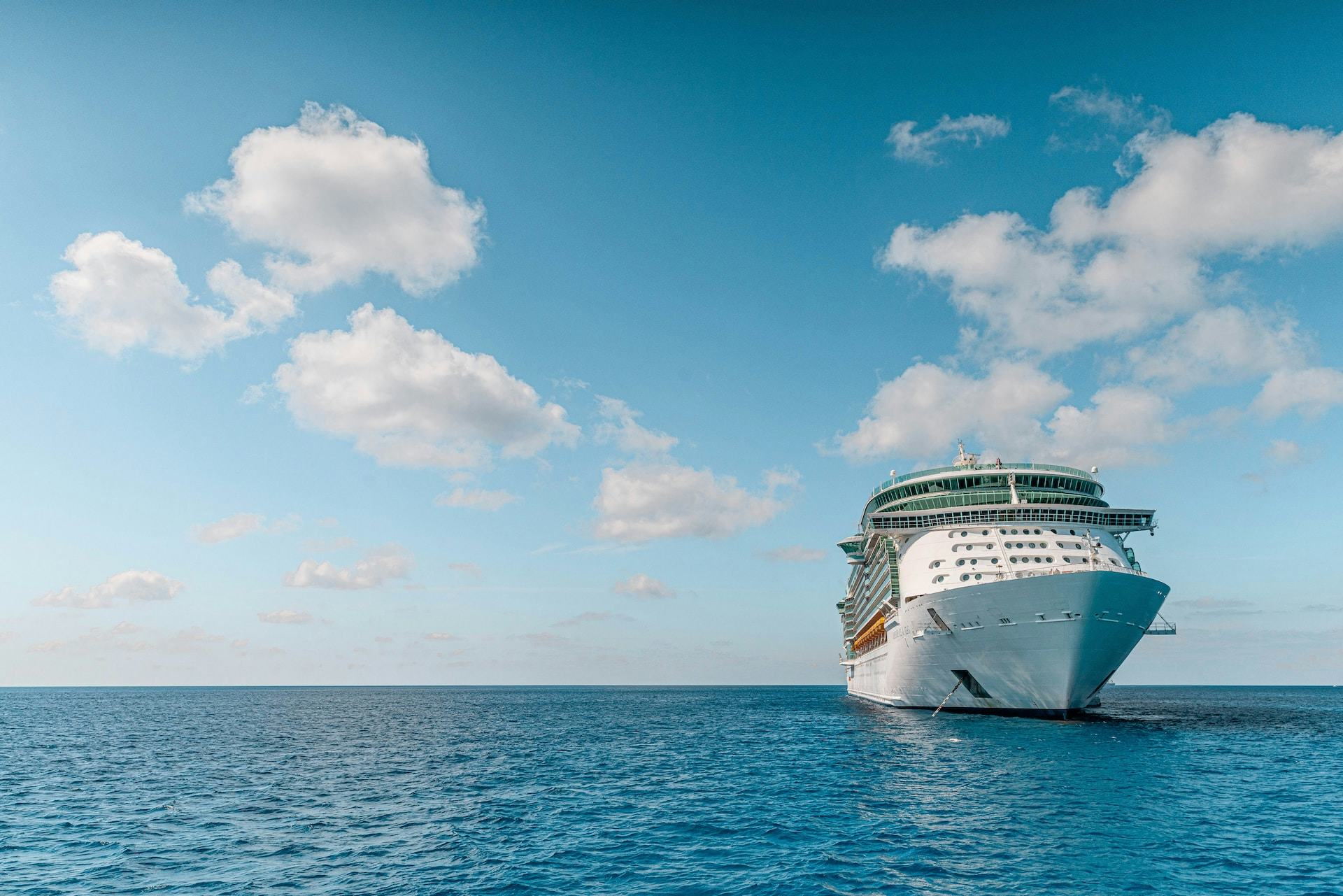 Cruise ship anchored in the middle of the ocean on a clear day.
