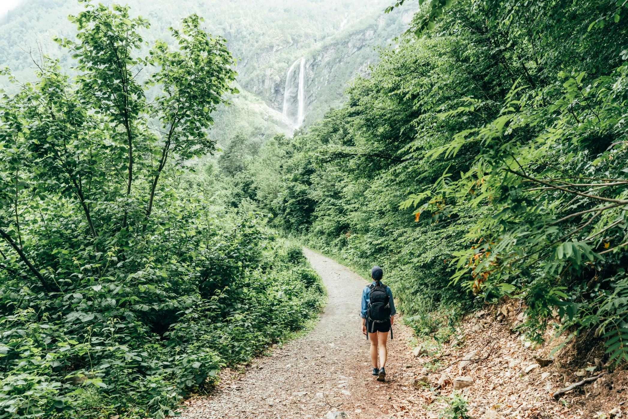 Woman walking on a trail through nature